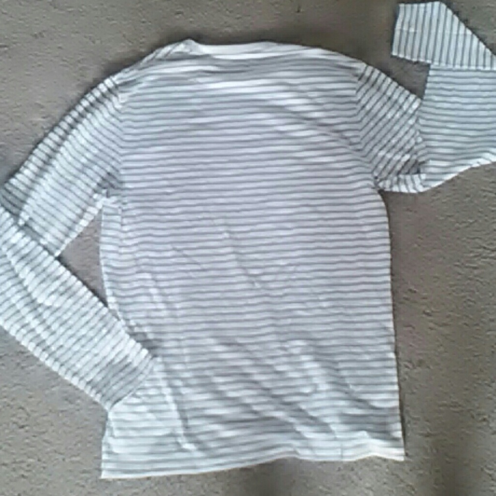 A white and gery striped sweatshirt